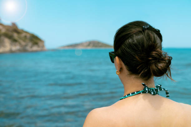 istock Woman facing the sea 1225090348