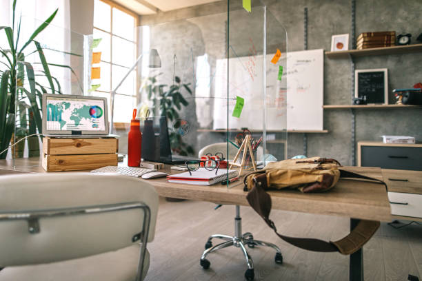 Interior of modern office Interior of office with glass partition on table and whiteboard in background office cubicle mask stock pictures, royalty-free photos & images