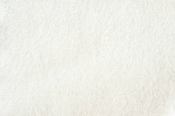 The texture of the soft white fabric with a pile, evenly spread out. Delicate textile backing for your design.