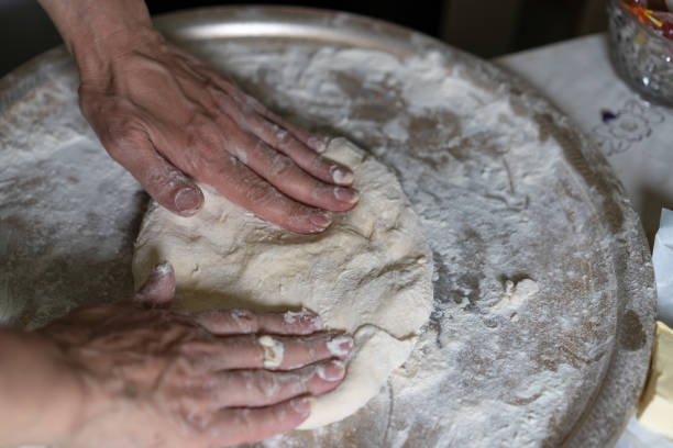 istock Hands knead the dough for further baking 1225093044