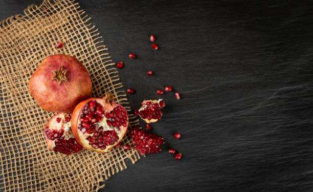 istock Fresh Ripe Organic Pomegranate Fruit with Juicy Seeds 1225094483
