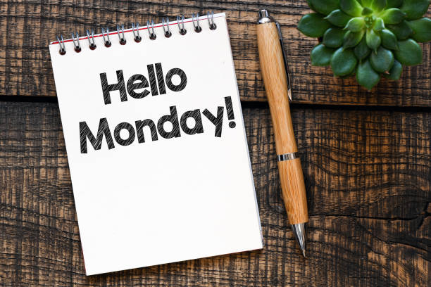 istock Hello Monday words written in a notebook on a wooden table. 1225097147