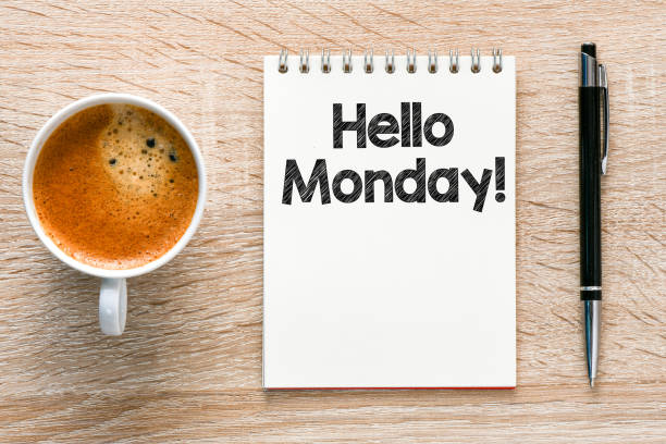 istock Hello Monday words written in a notebook on a wooden table. 1225099125