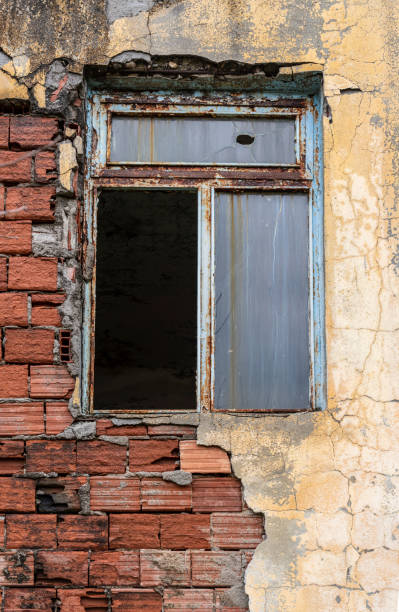 istock Broken glass of a window in an abandoned house 1225100476