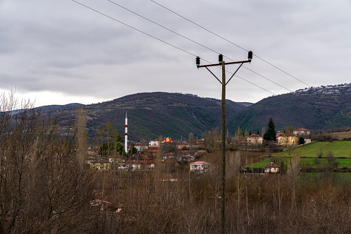 Power Lines near agricultural fields and turkish village
