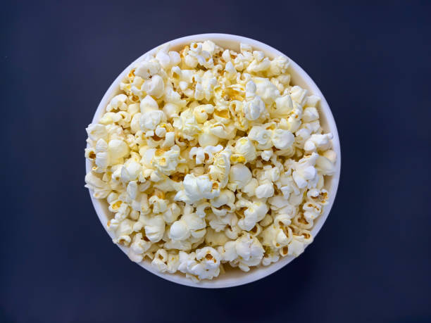 istock Close up delicious fresh buttery popcorn in a bowl 1225101482