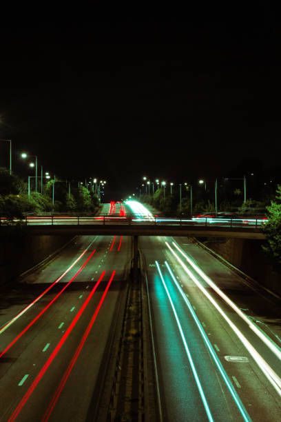 istock Red and white light trails created by car headlights 1225104101