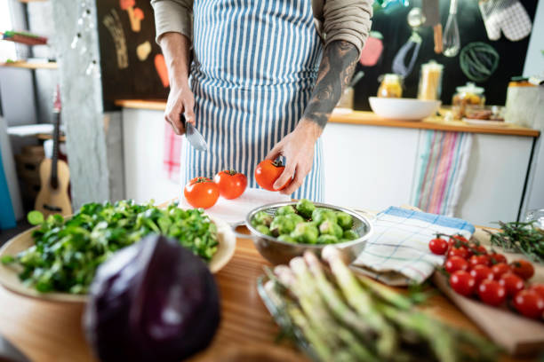 istock An unrecognizable man preparing healthy meal at his kitchen 1225108628