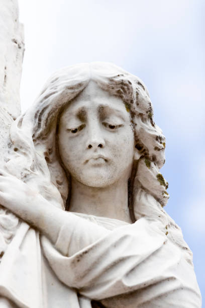 istock Angel, old statue of grieving angle, sky background with copy space 1225108669