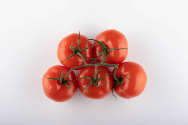 istock Ripe Fresh Cherry Tomatoes on Branch Isolated on White Background 1225109360