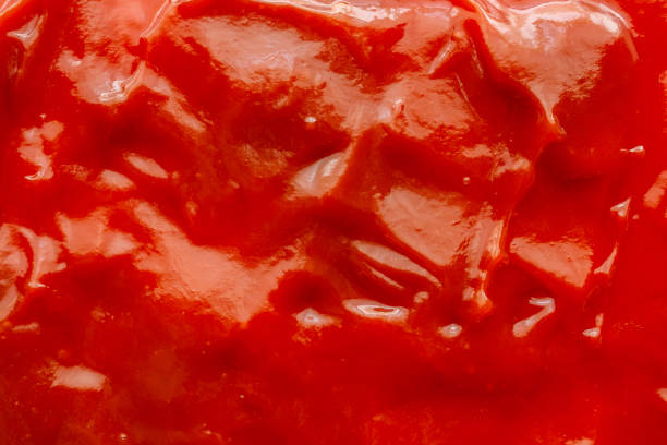 istock Tomato sauce ketchup texture background close up 1225115555