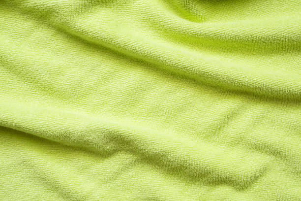 istock Green towel fabric texture surface close up background 1225115563