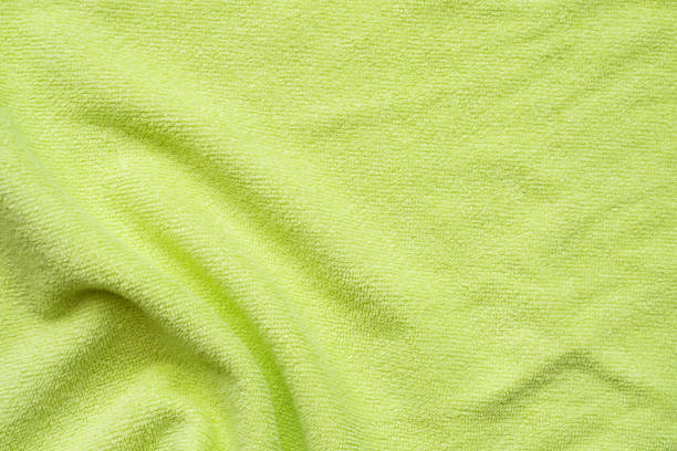istock Green towel fabric texture surface close up background 1225115568
