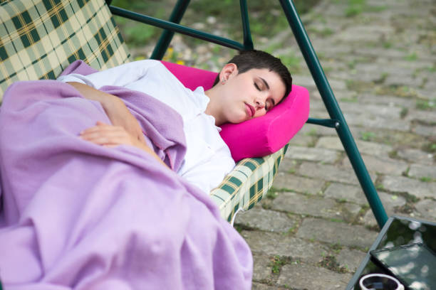 istock Woman sleeping in the deck chair 1225117410