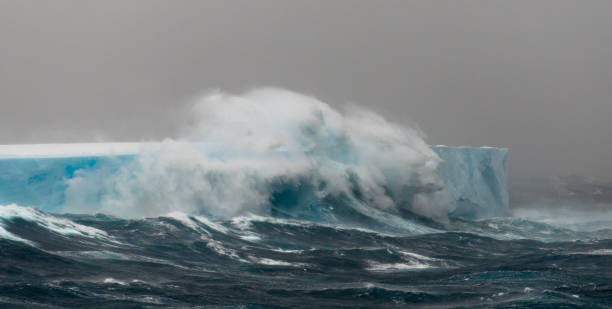 istock Wave breaking over huge tabular iceberg, Southern Ocean, Antarctica 1225119179