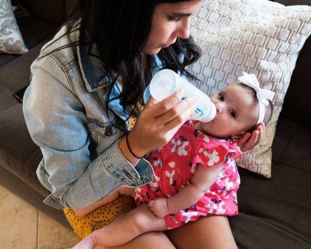 istock Beautiful Baby Girl Feeding 1225122371