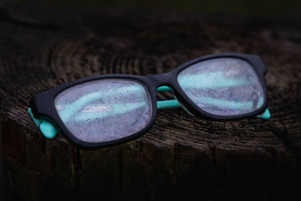 istock A pair of plastic eyeglasses rest on a wooden piling covered with dew 1225122510