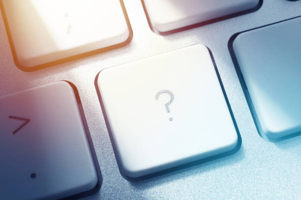 Close-up on Question Mark Key of Computer Keyboard.