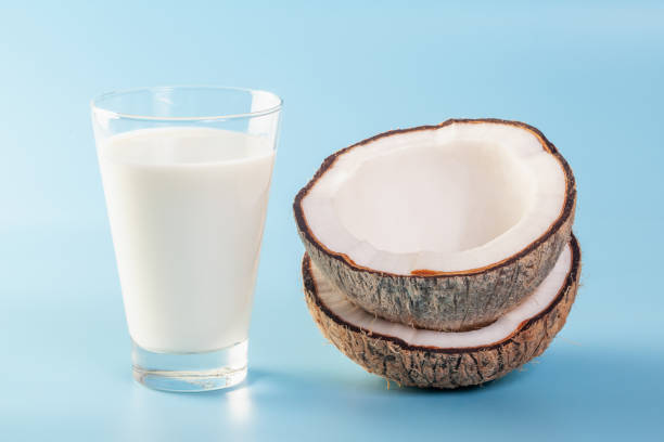 istock Coconut  with coconut milk  on blue ground 1225129749
