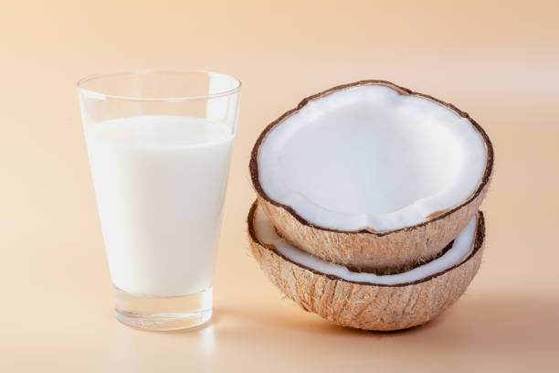 istock Fresh coconut on an orange ground 1225129826