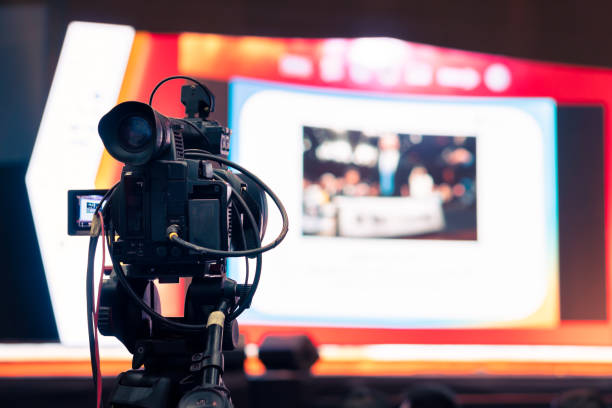 istock Video camera man recording live show digital broadcast 1225129841