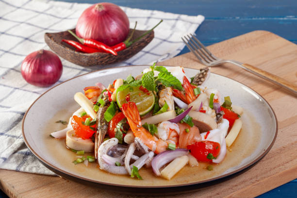 istock Spicy seafood salad with Thai vegetables 1225131801