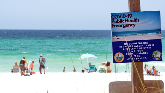 Signs for COVID-19 on Panama City Beach, Florida, USA, shortly after the beaches reopened from the COVID-19 closures