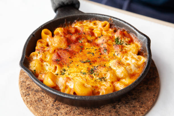istock Baked macaroni and cheese with fresh tomato sauce 1225136996