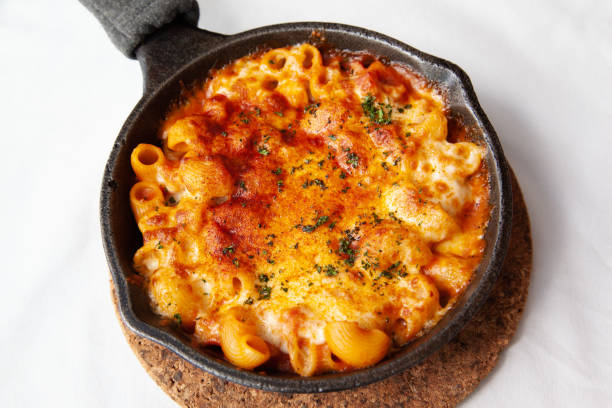 istock Baked macaroni and cheese with fresh tomato sauce 1225137017