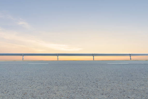 istock Empty asphalt road and beautiful sunset sky 1225137911
