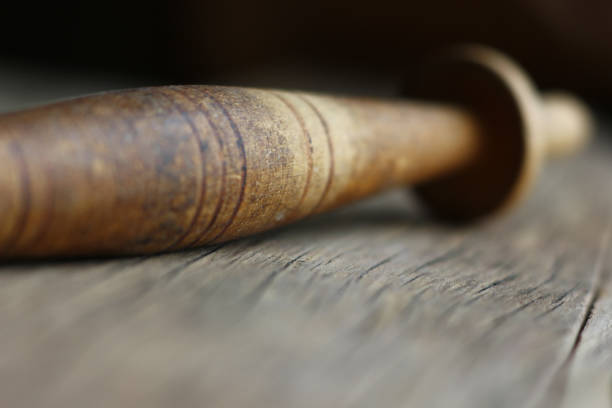 istock an old knitting spindle on a structural table made of cracked wood 1225142609