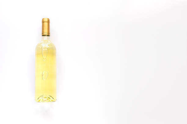 istock White wine bottle with label with on white background. Copy space 1225147116