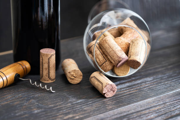 istock Many  used wine corks  and  corkscrew  with wine bottle on  wooden background. Wine making and wine degustation concept. 1225147119