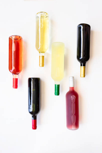istock Different wines bottles red, white, rose and bordeaux on white background. Wine Collection Flat lay image. 1225147120
