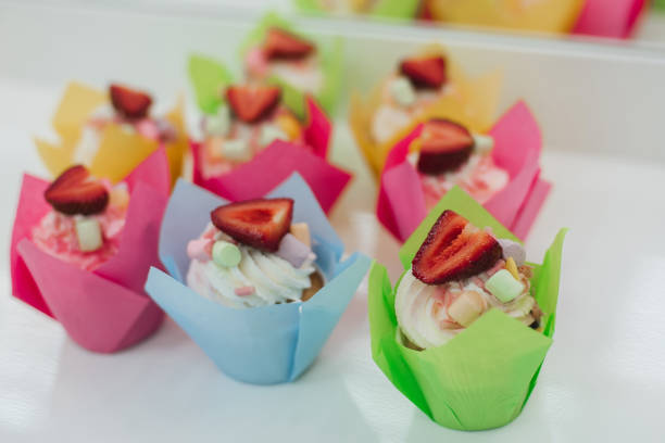 istock sweet cupcakes muffins with fresh strawberries and white cream 1225147401