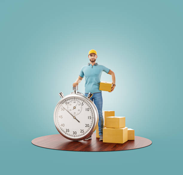 istock Delivery man with stopwatch timer holding cardboard box. 1225148429
