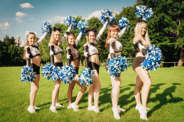 istock Cheer Line Smiling Cheerleader Girls 1225149566