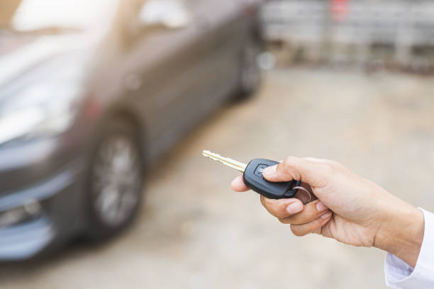 istock Hand presses on the remote control to lock car. 1225150749