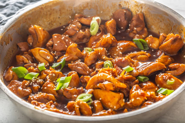 istock Freshly cooked chicken stew in a metal bowl with spring onion and seesame sprinkle 1225151638