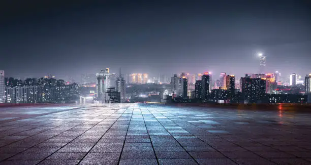 Photo of Night view of city lights in front of marble square, Xuzhou, China