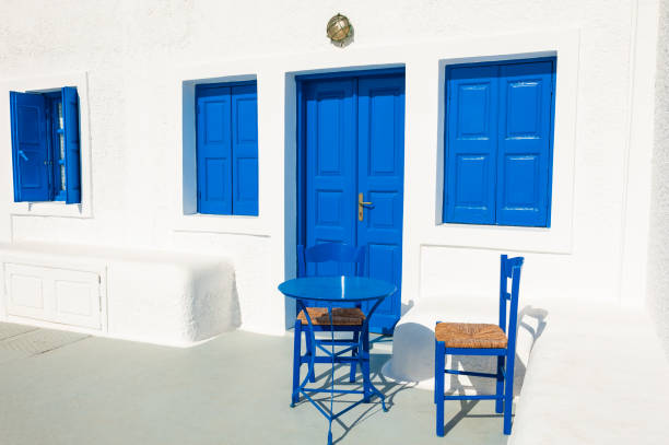 Typical white Mediterranean house, with blue door, in the small fishing village of cadaques, typical Mediterranean village on the Costa Brava of Spain