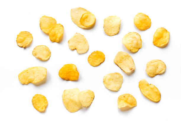 Potato Chips Potato chips isolated on white background. Crispy potato chips creative layout, top view, banner. potato chip photos stock pictures, royalty-free photos & images