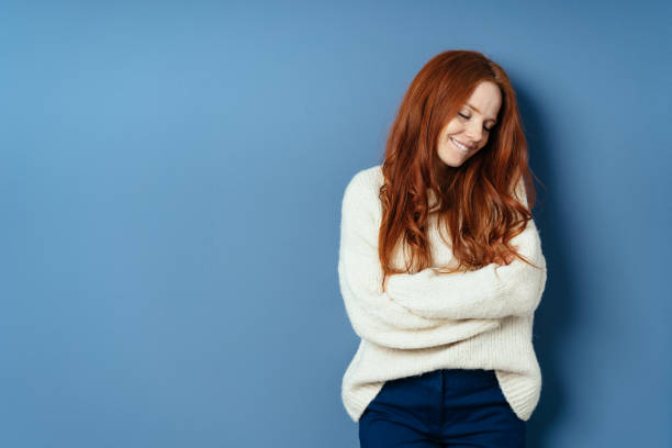 istock Sweet demure young woman looking aside 1225155515