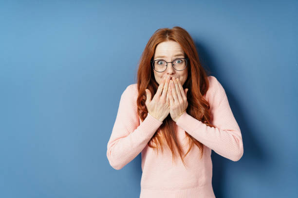 istock Young woman trying to stifle a laugh 1225155688