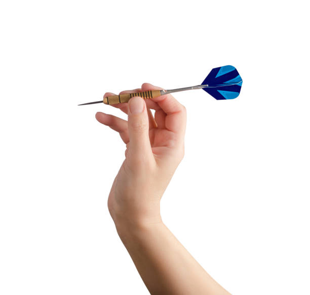 istock Human hand and dart isolated on white background 1225155872