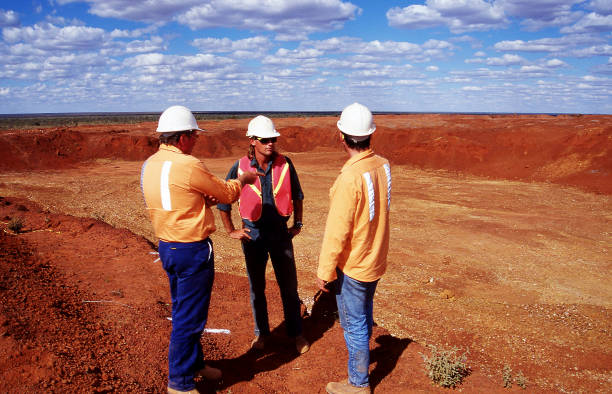 Tanami Desert, Northern Territory, Australia, May 20, 1995: View of open cut gold mine pit and workers in the red soil Tanami desert.