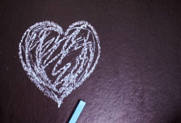 istock Heart drawn in chalk on a black background. 1225156106