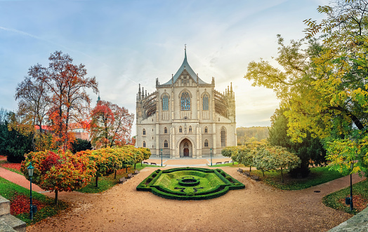 Kutna Hora, Czechia. Wide angle view of St Barbara's Cathedral on sunrise with autumn trees (HDR-image)