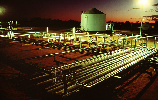 Mereenie, Northern Territory, Australia, April 21, 1994: Oil and Gas processing facility seen just before sunrise at the Mereenie Oil and Gas field, west of Alice Springs in the Northern Territory, Australia