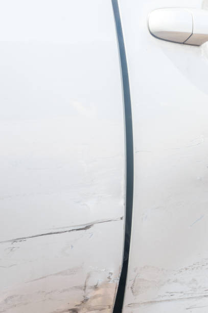 detail with hole between car doors after car accident. - fender bender imagens e fotografias de stock